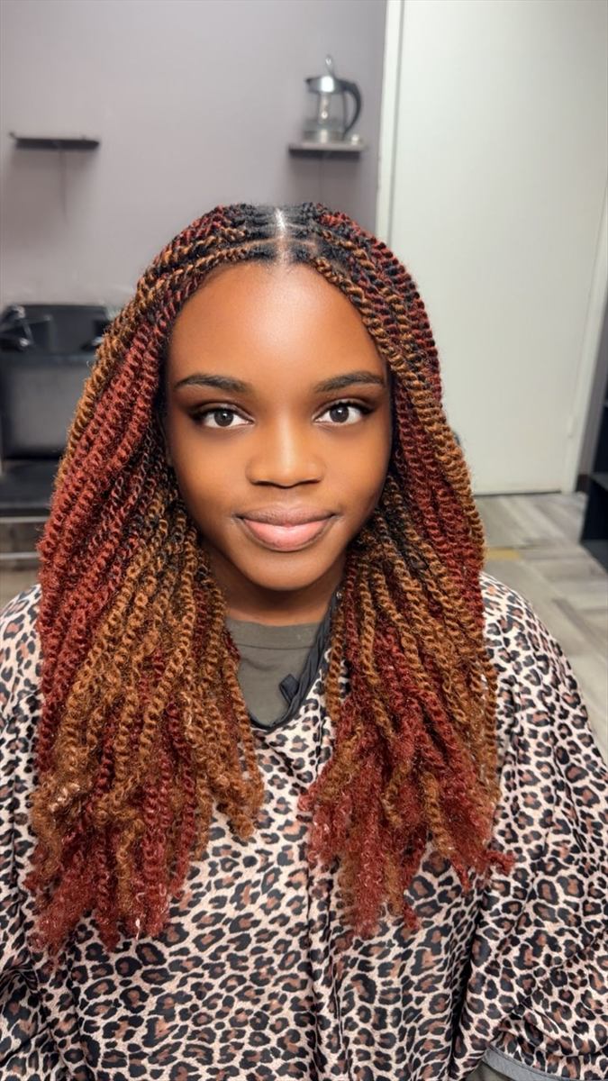 Copper and auburn spring twists with a middle part